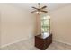 Home office with natural light, ceiling fan, and a sizable work desk at 19261 Quarterly Pkwy, Orlando, FL 32833
