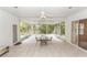 Enclosed patio featuring tile flooring, ceiling fan, and views of the backyard at 19261 Quarterly Pkwy, Orlando, FL 32833