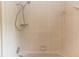 Close up of tiled shower with shower head and faucet at 19261 Quarterly Pkwy, Orlando, FL 32833