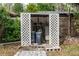 Exterior utilities behind a wooden lattice structure at 19261 Quarterly Pkwy, Orlando, FL 32833