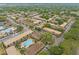 Aerial view of a community showcasing mature trees, pools, tennis courts and buildings at 200 St Andrews Blvd # 512, Winter Park, FL 32792