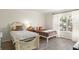 Bedroom featuring two twin beds, hardwood floors and lots of natural light at 200 St Andrews Blvd # 512, Winter Park, FL 32792
