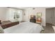 Bright bedroom with two beds, natural light, and gray wood flooring at 200 St Andrews Blvd # 512, Winter Park, FL 32792