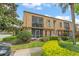 Well-maintained condo building with lush landscaping and a charming facade at 200 St Andrews Blvd # 512, Winter Park, FL 32792