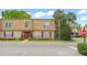 Charming two-story townhome with brick facade, red shutters, and well-manicured landscaping at 200 St Andrews Blvd # 512, Winter Park, FL 32792