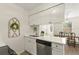 Bright kitchen with white cabinets, stainless steel appliances and hardware at 200 St Andrews Blvd # 512, Winter Park, FL 32792