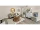 Comfortable living room featuring sleek wood flooring and stylish, neutral decor and furnishings at 200 St Andrews Blvd # 512, Winter Park, FL 32792