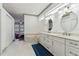 Luxurious bathroom with double vanity, marble floors, soaking tub, and neutral color palette at 2328 Warren Woods Dr, Orlando, FL 32835