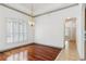 Inviting dining area with wood floors, a decorative chandelier, and plantation shutters at 2328 Warren Woods Dr, Orlando, FL 32835