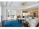 Bright living room with hardwood floors, a comfortable sofa, and an open floor plan to the kitchen at 2328 Warren Woods Dr, Orlando, FL 32835