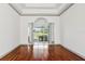 Spacious living room featuring gleaming wood floors, soaring ceilings, and an open floor plan at 2328 Warren Woods Dr, Orlando, FL 32835