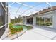 Enjoy this backyard oasis with a screened-in pool, lush landscaping, and a serene patio area for outdoor entertainment at 2328 Warren Woods Dr, Orlando, FL 32835