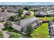 Aerial view of a backyard featuring a screened pool area and lush landscaping at 2355 Silver Palm Dr, Kissimmee, FL 34747