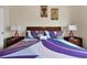 Cozy bedroom featuring decorative lighting and vibrant bedding with side tables at 2355 Silver Palm Dr, Kissimmee, FL 34747