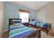 Bright bedroom featuring two twin beds, beachy decor, a sunny window, and a closet at 2355 Silver Palm Dr, Kissimmee, FL 34747
