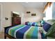 Comfortable bedroom featuring two twin beds with colorful striped bedding and themed decorations at 2355 Silver Palm Dr, Kissimmee, FL 34747