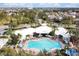 Aerial view of community pool, showing lounge chairs and manicured landscape at 2355 Silver Palm Dr, Kissimmee, FL 34747