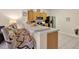 Functional kitchen featuring bar seating, and stainless steel refrigerator at 2355 Silver Palm Dr, Kissimmee, FL 34747