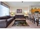 Inviting living area open to the kitchen featuring bar seating and tile flooring at 2355 Silver Palm Dr, Kissimmee, FL 34747
