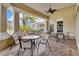 Covered outdoor seating area with tables and chairs at 2355 Silver Palm Dr, Kissimmee, FL 34747