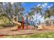View of the community playground featuring slides and climbing structures at 2355 Silver Palm Dr, Kissimmee, FL 34747