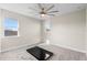 Spacious bedroom with ample natural light, ceiling fan, and carpet flooring providing comfort at 2383 Regency Park Dr, Deland, FL 32724