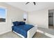 Bedroom with two windows, neutral walls, and modern queen bed at 2383 Regency Park Dr, Deland, FL 32724