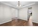 Spacious dining room featuring trey ceilings, wood floors, and classic chandelier lighting at 2383 Regency Park Dr, Deland, FL 32724