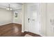 Bright foyer featuring hardwood floors and a decorative front door with patterned glass allowing natural light to filter through at 2383 Regency Park Dr, Deland, FL 32724