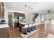 Modern kitchen featuring a large island with barstool seating, stainless steel appliances, and open access to living areas at 2383 Regency Park Dr, Deland, FL 32724