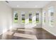 Bright sitting room featuring hardwood floors, recessed lighting and natural light from large windows at 2383 Regency Park Dr, Deland, FL 32724