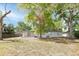 Charming home featuring a lush backyard with mature trees offering plenty of shade at 2417 Healy Dr, Orlando, FL 32818