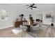 Dining room features modern decor, wood floors, ceiling fan, and neutral paint at 2417 Healy Dr, Orlando, FL 32818