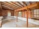 Unfinished garage with exposed framing and concrete floors ready to be converted into usable space at 2417 Healy Dr, Orlando, FL 32818