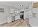 Updated kitchen with stainless steel appliances, white cabinetry, and ample counter space at 2417 Healy Dr, Orlando, FL 32818