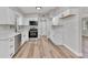 Bright kitchen with white cabinets, stainless steel appliances, and modern finishes at 2417 Healy Dr, Orlando, FL 32818