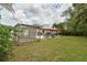 Spacious backyard with garden, patio, and outdoor dining area at 271 W 11Th St, Chuluota, FL 32766