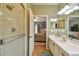 The bathroom boasts a glass shower and plenty of counter space at 271 W 11Th St, Chuluota, FL 32766