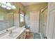 This bathroom features a shower with glass doors and a neutral color palette at 271 W 11Th St, Chuluota, FL 32766