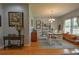 Dining area with stylish table and seating for four, complemented by hardwood floors and ample natural light at 271 W 11Th St, Chuluota, FL 32766