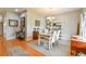 Charming dining room with a farmhouse style table and an elegant chandelier with artwork on the wall at 271 W 11Th St, Chuluota, FL 32766