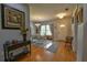 Open dining area with hardwood floors, four-chair table set, and seamless flow to the entryway at 271 W 11Th St, Chuluota, FL 32766