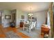 Cozy dining room with hardwood floors, elegant furniture, and lots of natural light at 271 W 11Th St, Chuluota, FL 32766