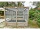 Enclosed garden with raised beds in a sunny backyard setting at 271 W 11Th St, Chuluota, FL 32766