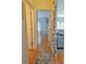 Hallway with hardwood floors that connects the living room and the bedroom at 271 W 11Th St, Chuluota, FL 32766