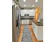 Spacious kitchen features stainless steel appliances, ample cabinet space, and a long central island at 271 W 11Th St, Chuluota, FL 32766