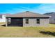 Backyard showing patio on home with a large lawn at 2837 Darlington Oak Ln, Ocoee, FL 34761
