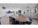 Open-concept living space with a dining table, kitchen, and view into the living room at 2837 Darlington Oak Ln, Ocoee, FL 34761