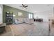 Inviting living area with a sectional couch, modern shelving, and an adjacent dining area at 2837 Darlington Oak Ln, Ocoee, FL 34761