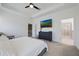 Spacious bedroom with a king-size bed, ensuite bathroom, and a serene atmosphere at 2837 Darlington Oak Ln, Ocoee, FL 34761